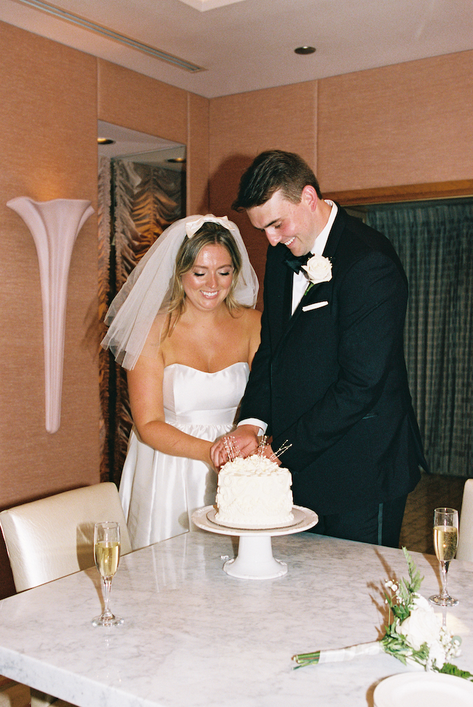 couple cutting wedding cake