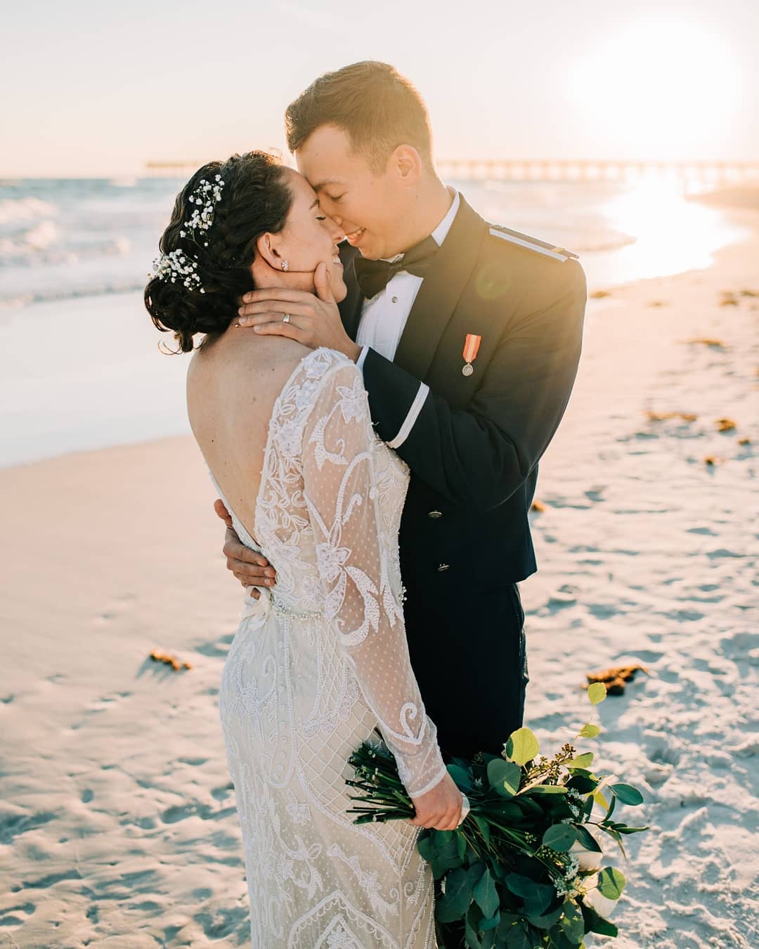 Bride and Groom kissing on beach