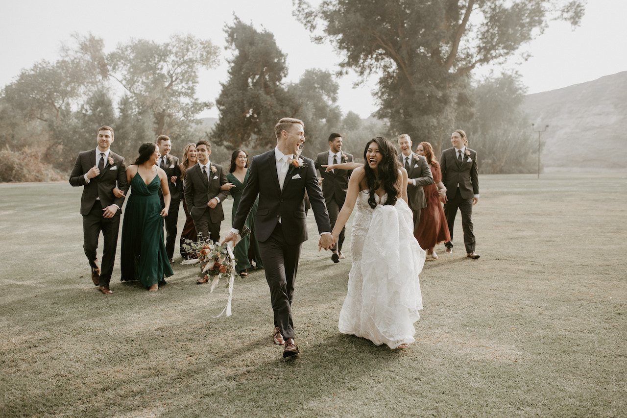 wedding party walking and laughing