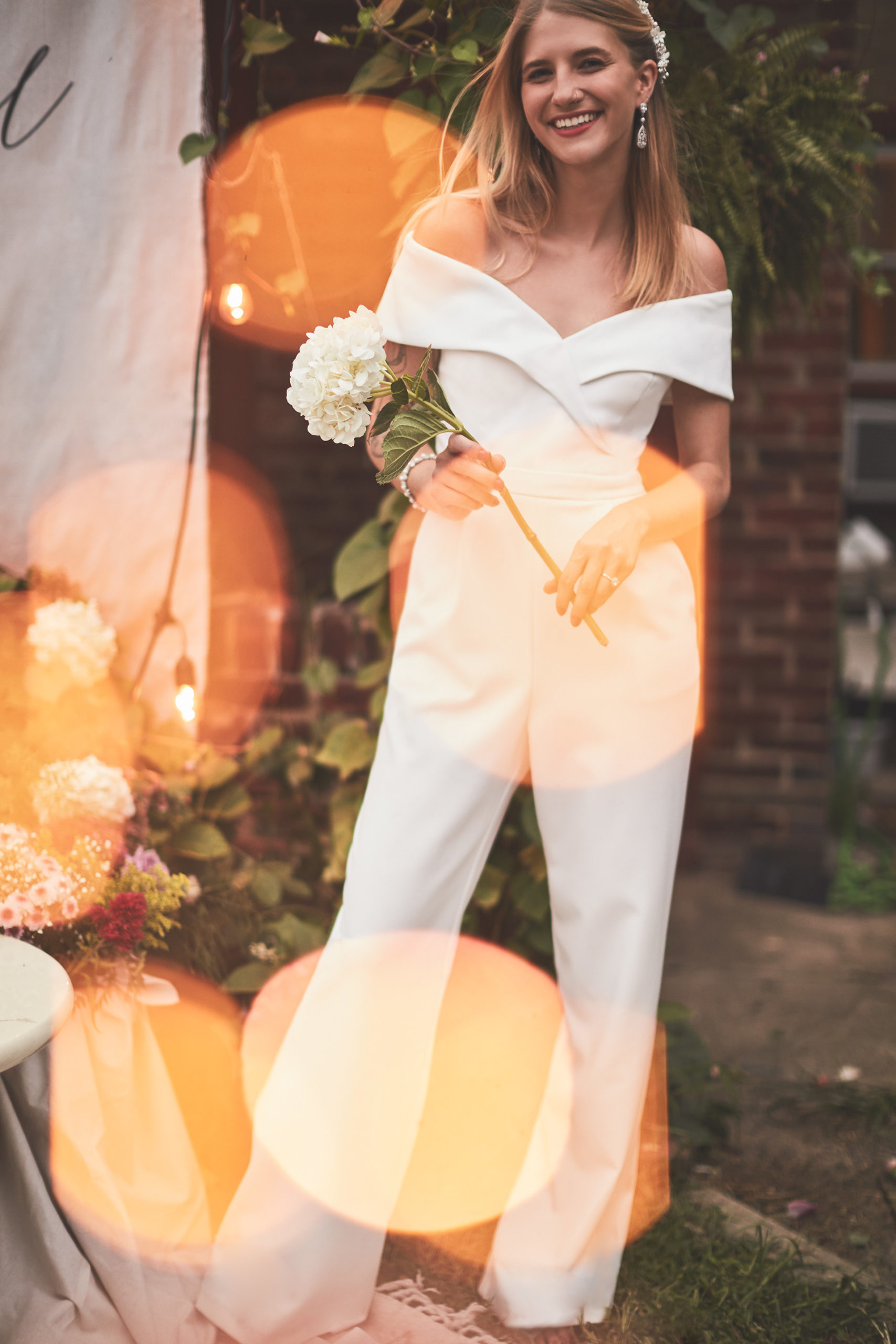 Bride in white jumpsuit