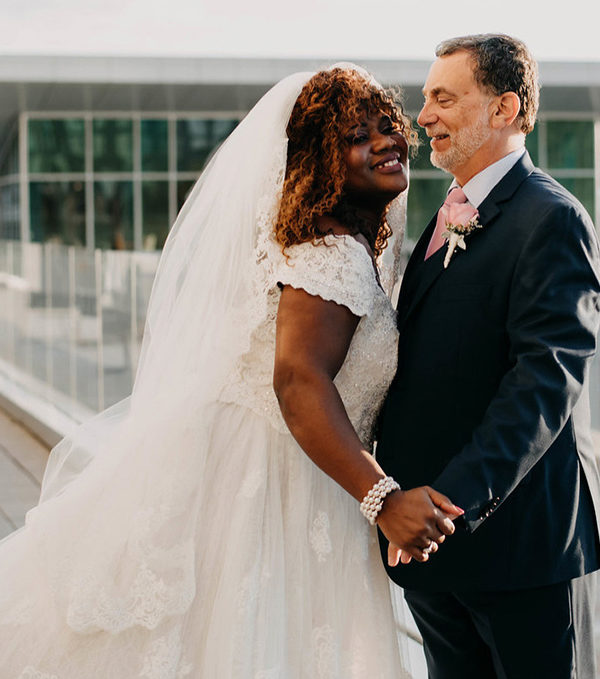 Bride and Groom Holding Hands