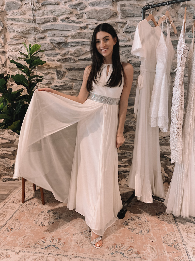 bride in long white dress with flowy mesh skirt