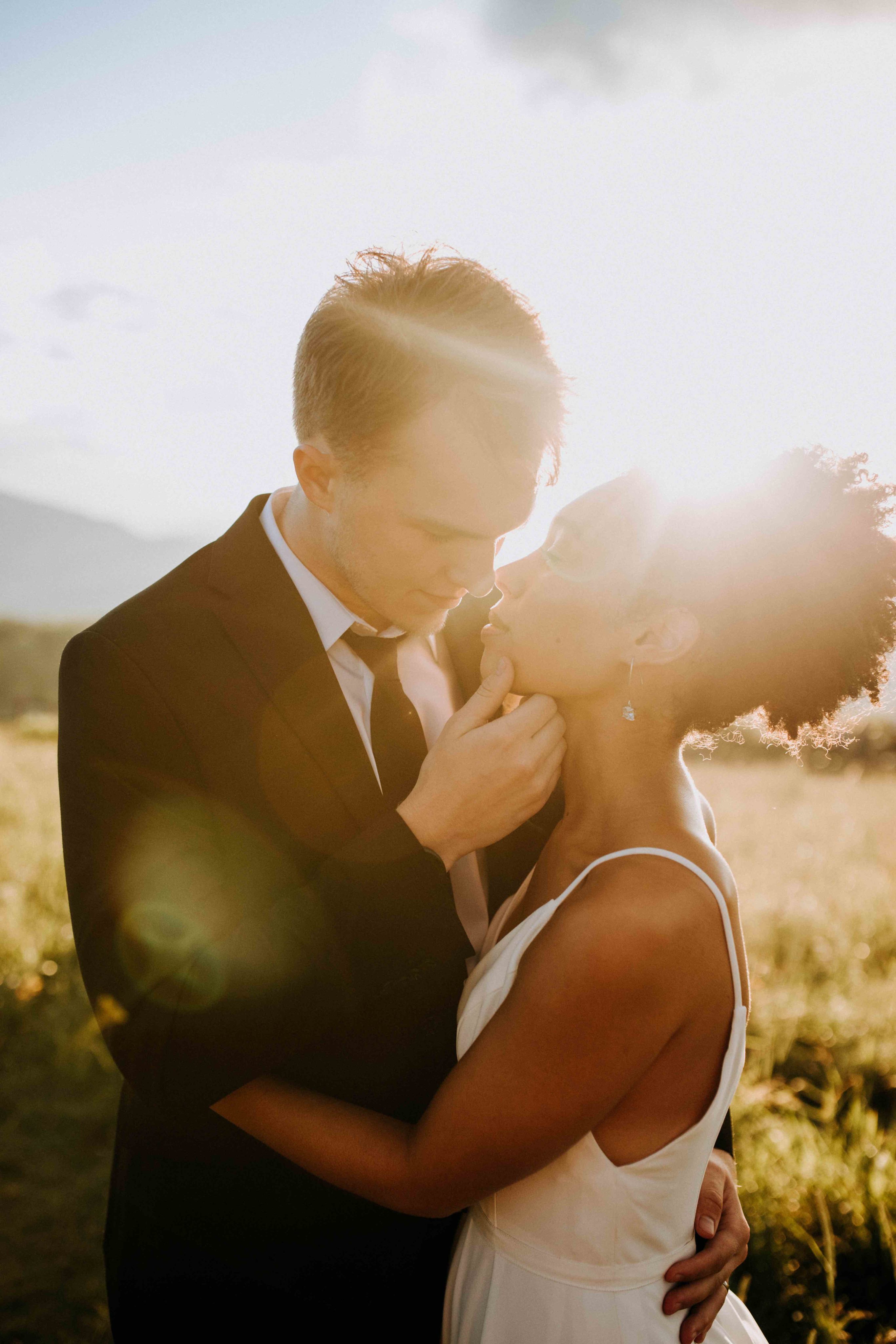 Breanna and Dalton Kissing with Sunset in Background