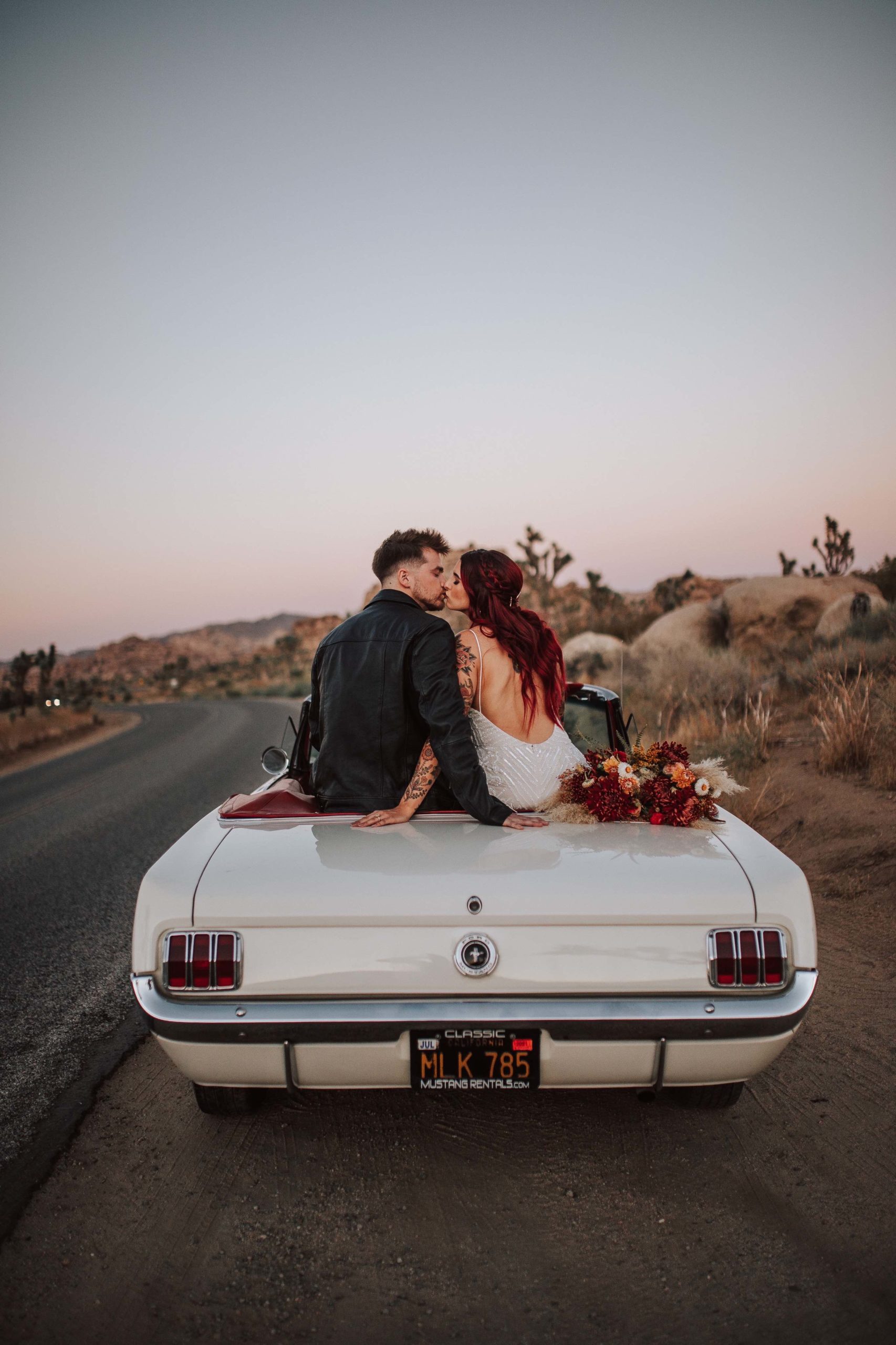 Jordan and Tylar kissing in the car at sunset