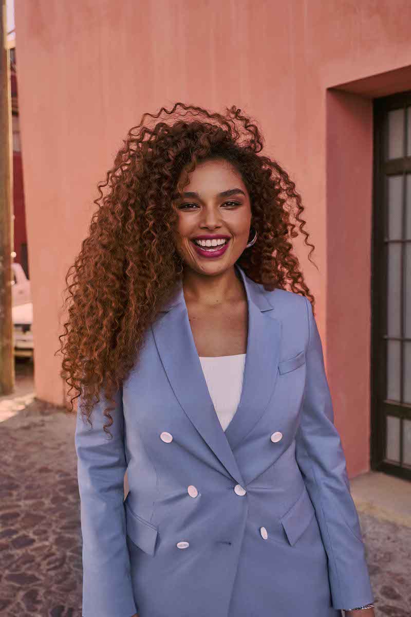 woman in periwinkle suit