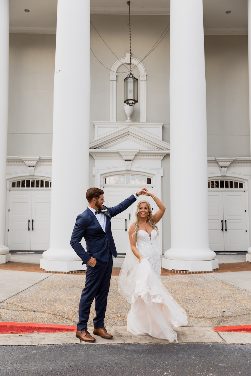 groom twirling bride - summer wedding in Georgia 