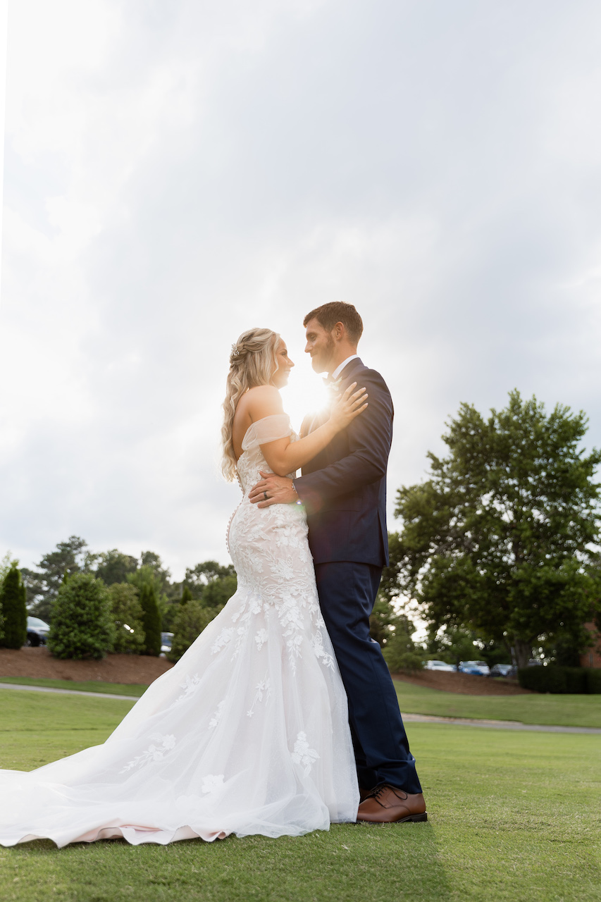 bride and groom embracing
