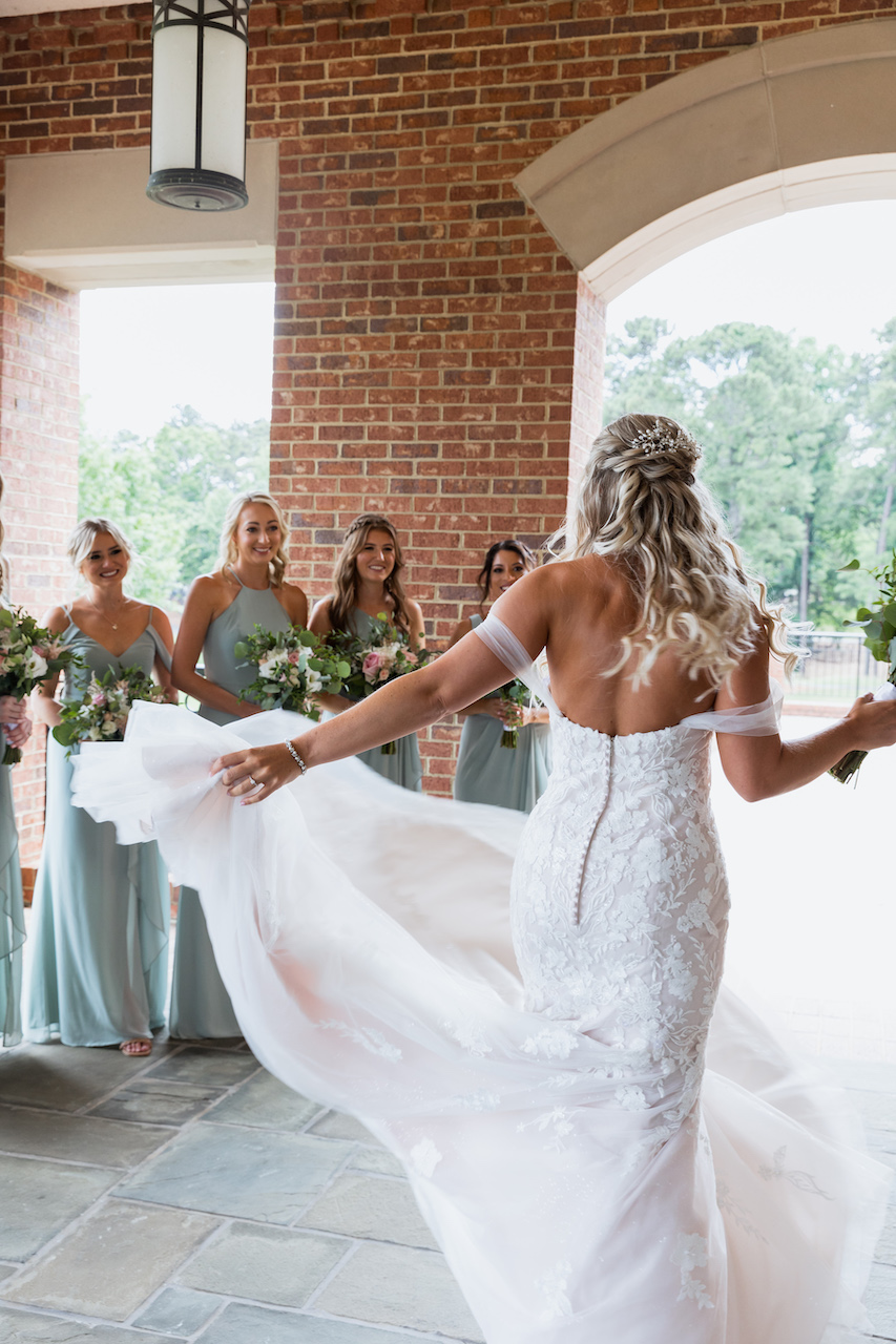 bride and bridesmaid first look