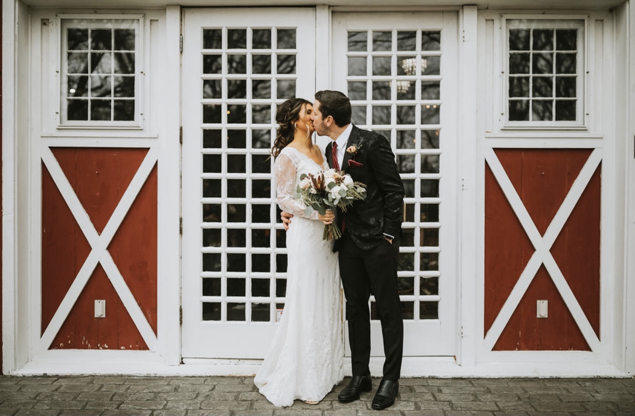 Bride and Groom sharing a kiss