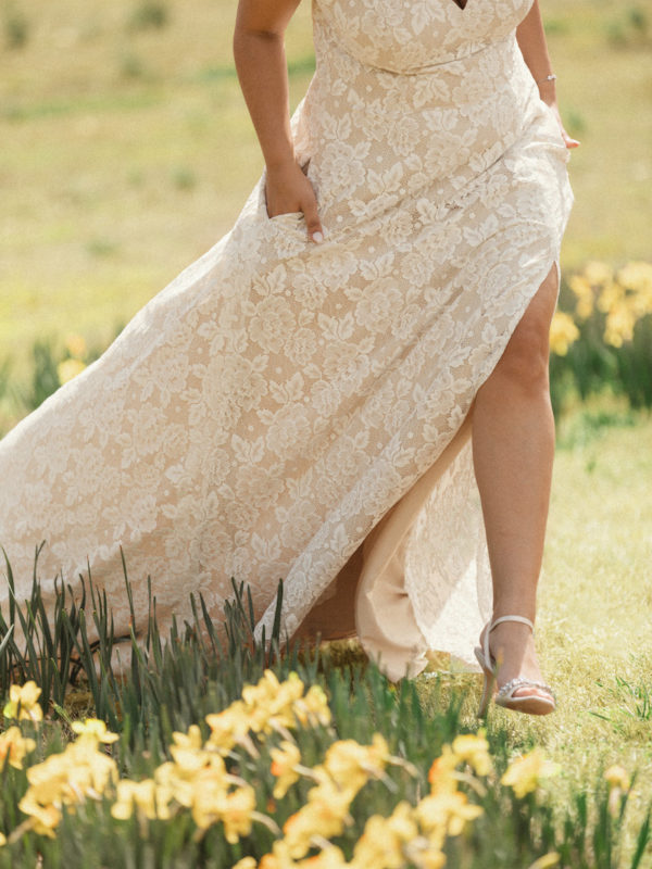 A bride walking through a garden