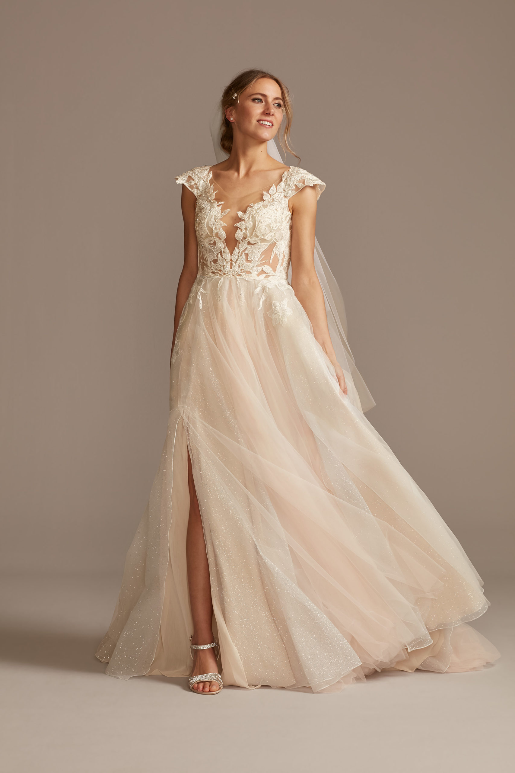 bride wearing ethereal Illusion Cap Sleeve Lace Appliqued Wedding Dress