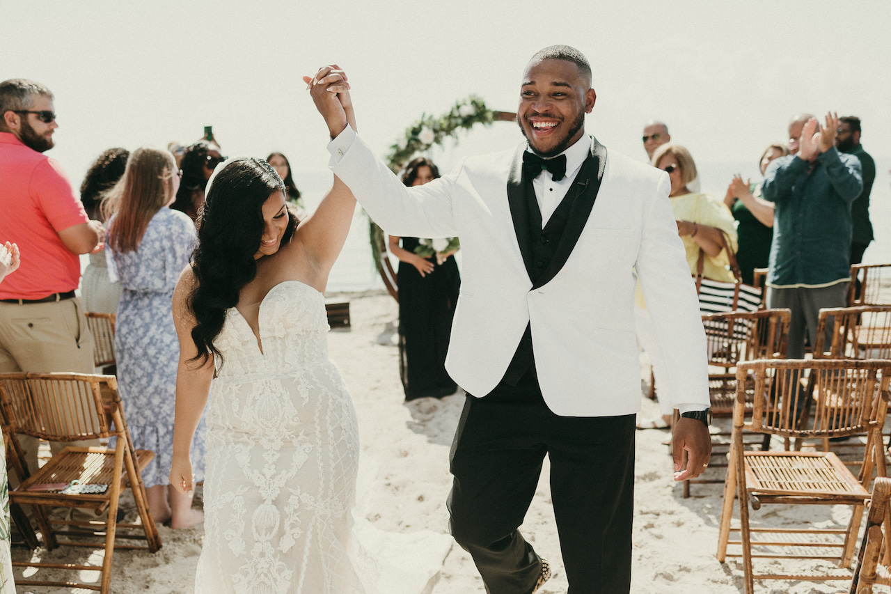 bride and groom celebrating at tropical wedding in florida